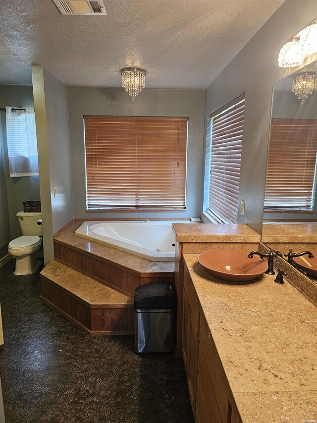 161 Funderburg Rd, Mineral Springs, AR 71851 - bathroom featuring an inviting chandelier, a tub with jets, a textured ceiling, and visible vents