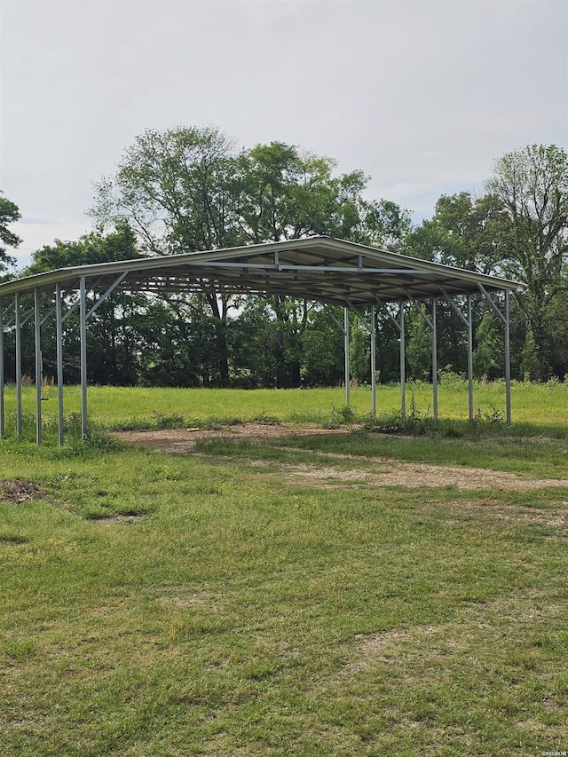 161 Funderburg Rd, Mineral Springs, AR 71851 - surrounding community featuring a lawn and a carport
