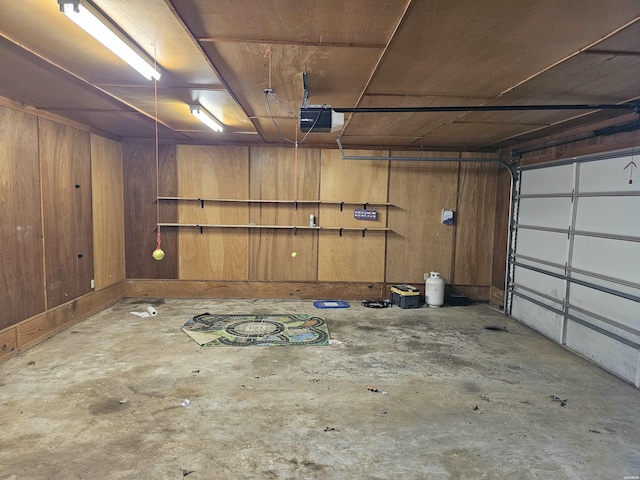 161 Funderburg Rd, Mineral Springs, AR 71851 - garage with a garage door opener and wood walls