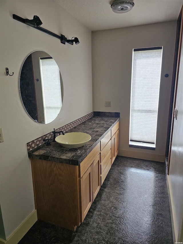 161 Funderburg Rd, Mineral Springs, AR 71851 - bathroom featuring vanity, baseboards, and concrete flooring