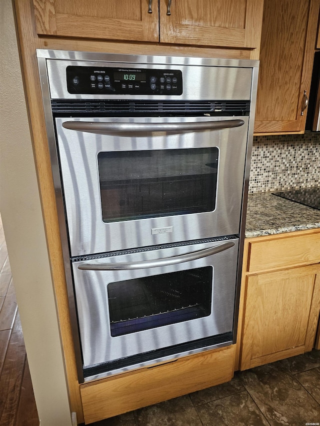 161 Funderburg Rd, Mineral Springs, AR 71851 - details featuring dark stone counters, tasteful backsplash, double oven, and black electric stovetop