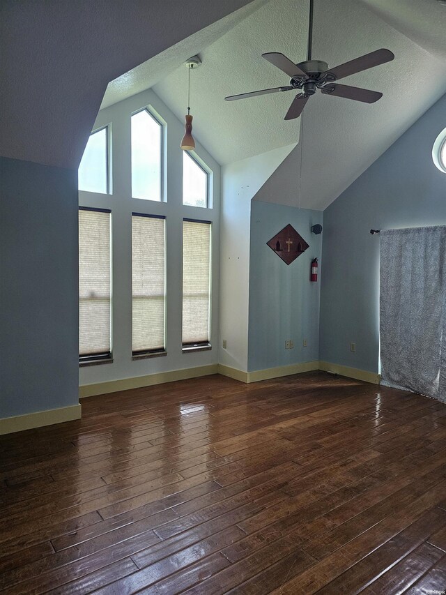 161 Funderburg Rd, Mineral Springs, AR 71851 - unfurnished living room with a ceiling fan, vaulted ceiling, hardwood / wood-style flooring, and a textured ceiling