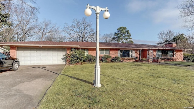 ranch-style home with brick siding, a chimney, concrete driveway, a front yard, and a garage