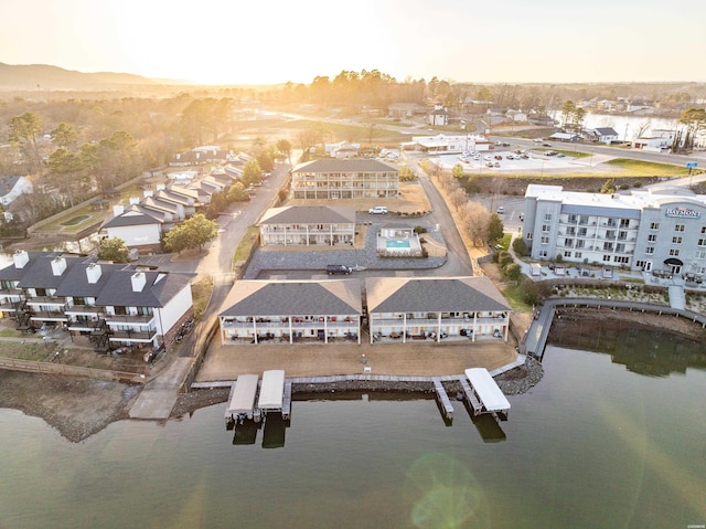 drone / aerial view featuring a water view and a residential view