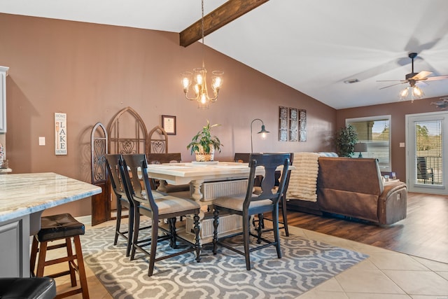 dining space featuring lofted ceiling with beams, visible vents, ceiling fan with notable chandelier, and light tile patterned floors