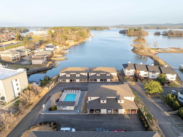 birds eye view of property with a residential view and a water view