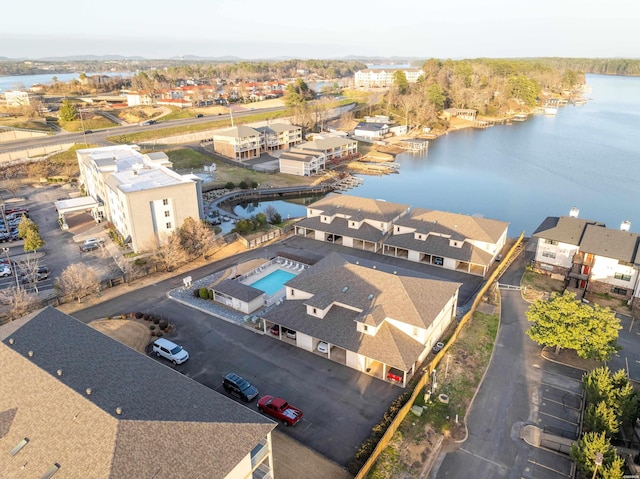 bird's eye view with a water view and a residential view