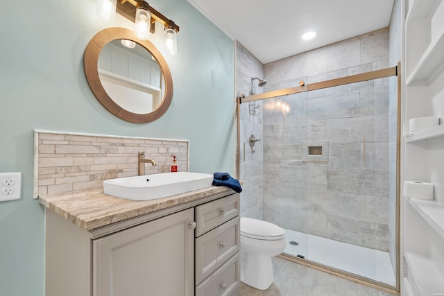 bathroom with toilet, tasteful backsplash, vanity, and a shower stall