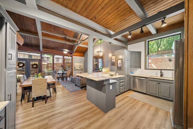 kitchen featuring plenty of natural light, wooden ceiling, light stone counters, stainless steel appliances, and gray cabinetry