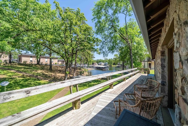 balcony featuring a water view