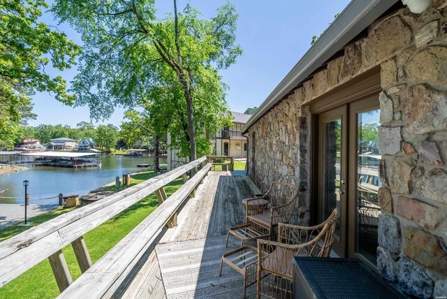 wooden deck with a water view