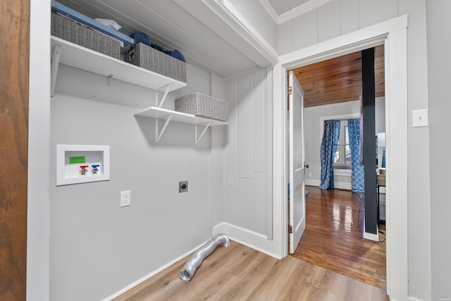 washroom featuring laundry area, baseboards, light wood-style floors, washer hookup, and electric dryer hookup