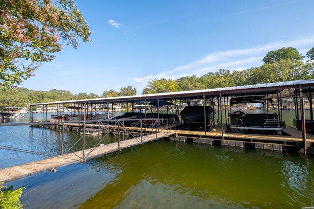 view of dock with a water view and boat lift