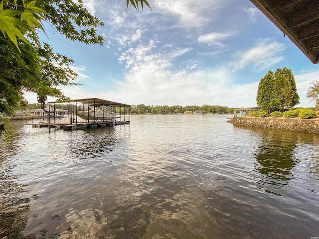 dock area featuring a water view and boat lift