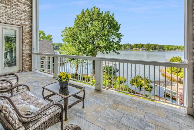 balcony featuring a water view