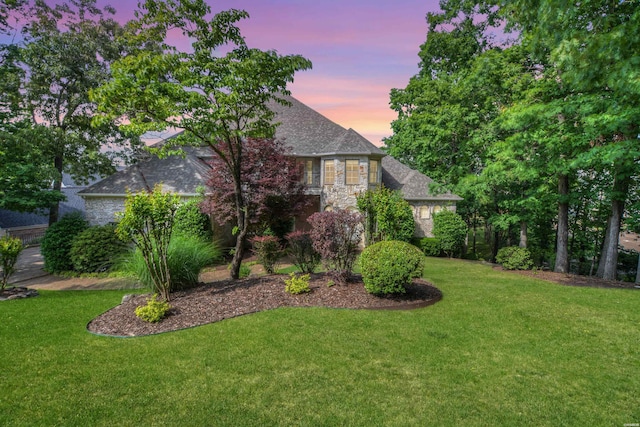 view of front of property featuring a front yard and stone siding