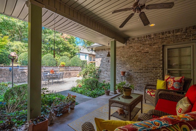 view of patio / terrace with an outdoor living space and a ceiling fan