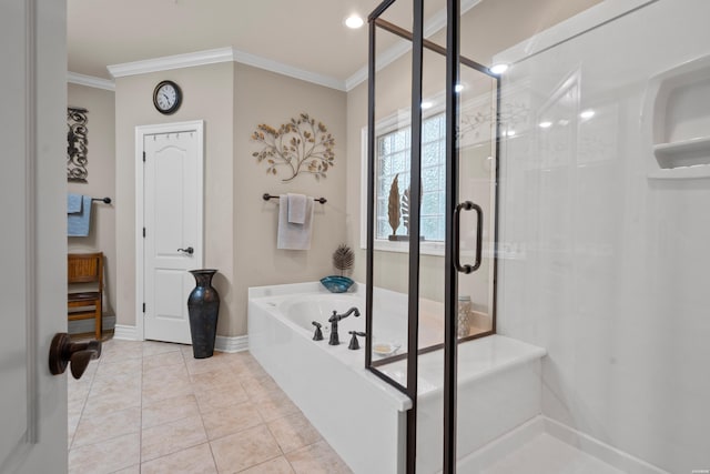 bathroom featuring ornamental molding, a shower stall, a bath, baseboards, and tile patterned floors