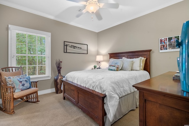 bedroom with baseboards, ornamental molding, a ceiling fan, and light colored carpet