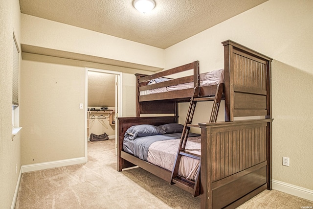 451 Lakeland Dr Unit G-4, Hot Springs, AR 71913 - bedroom featuring light carpet, a textured wall, a textured ceiling, and baseboards