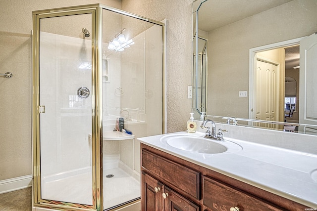451 Lakeland Dr Unit G-4, Hot Springs, AR 71913 - full bathroom featuring a stall shower, a textured wall, and vanity