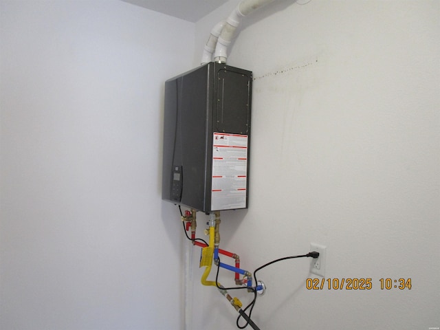 utility room with water heater