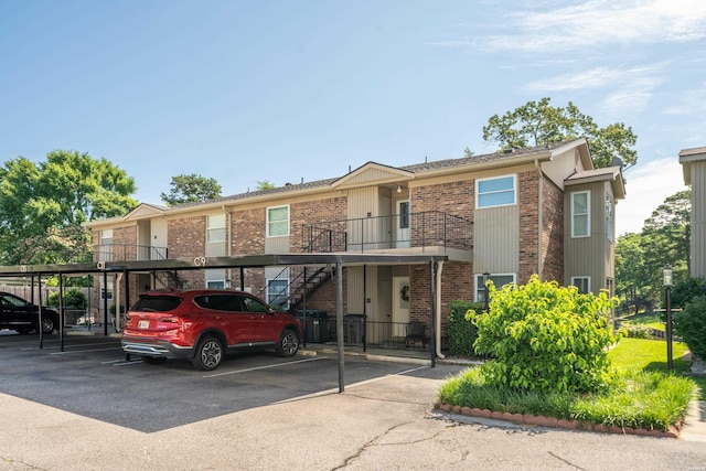 1201 Airport Rd Unit D-14, Hot Springs, AR 71913 - townhome / multi-family property with brick siding, covered parking, and stairs