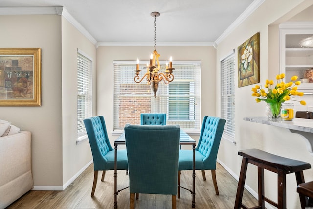 1201 Airport Rd Unit D-14, Hot Springs, AR 71913 - dining area featuring a chandelier, wood finished floors, crown molding, healthy amount of natural light, and baseboards
