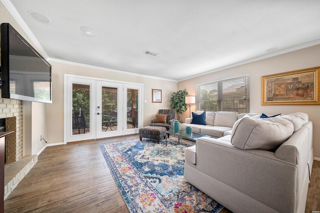 1201 Airport Rd Unit D-14, Hot Springs, AR 71913 - living room featuring a fireplace, wood finished floors, ornamental molding, and baseboards