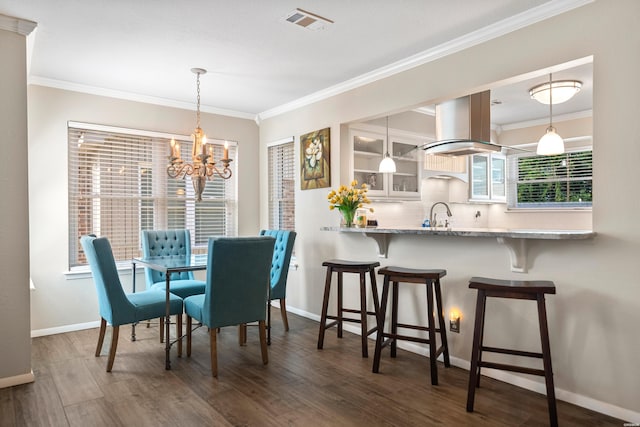 1201 Airport Rd Unit D-14, Hot Springs, AR 71913 - dining space with a chandelier, baseboards, crown molding, and wood finished floors