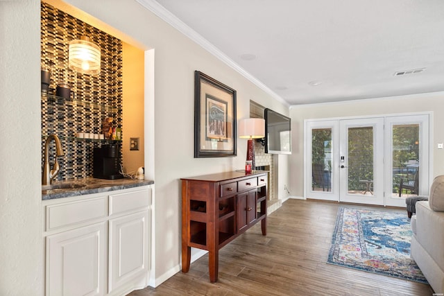 1201 Airport Rd Unit D-14, Hot Springs, AR 71913 - wine room featuring a sink, french doors, wood finished floors, ornamental molding, and baseboards