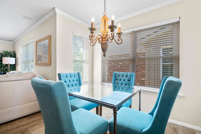 1201 Airport Rd Unit D-14, Hot Springs, AR 71913 - dining area featuring a chandelier, wood finished floors, ornamental molding, and baseboards