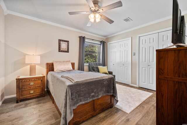 1201 Airport Rd Unit D-14, Hot Springs, AR 71913 - bedroom with wood finished floors, ornamental molding, multiple closets, and baseboards