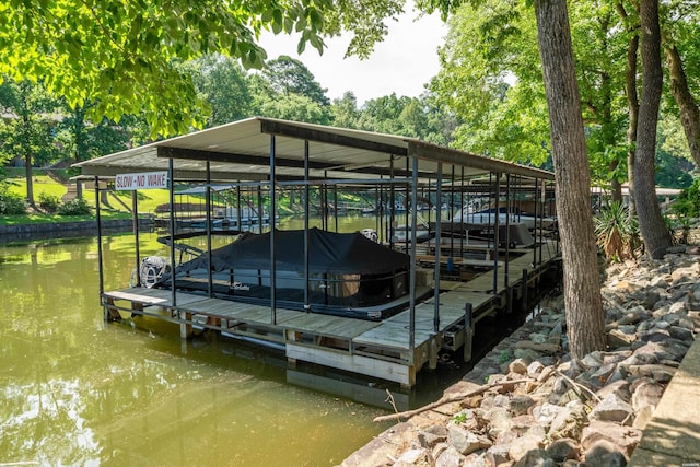 1201 Airport Rd Unit D-14, Hot Springs, AR 71913 - dock featuring boat lift, a water view, and view of wooded area