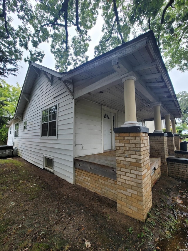 view of side of property featuring a porch