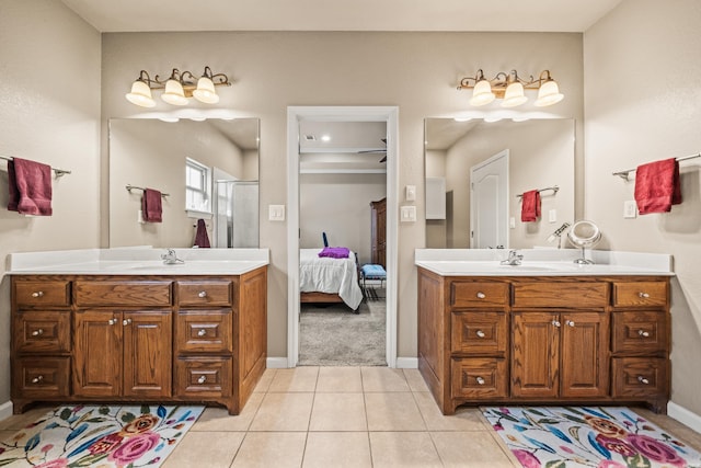 121 Wildwood Forest Rd, Hot Springs, AR 71913 - ensuite bathroom with baseboards, tile patterned floors, a stall shower, connected bathroom, and two vanities