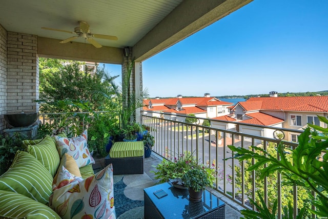 balcony featuring a residential view and a ceiling fan