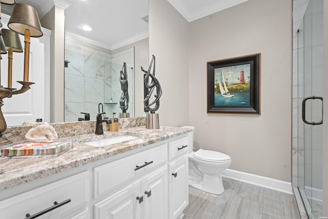 full bath with a marble finish shower, baseboards, toilet, crown molding, and vanity