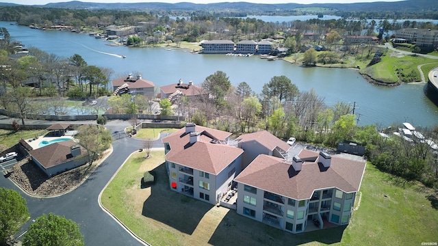 drone / aerial view with a water view