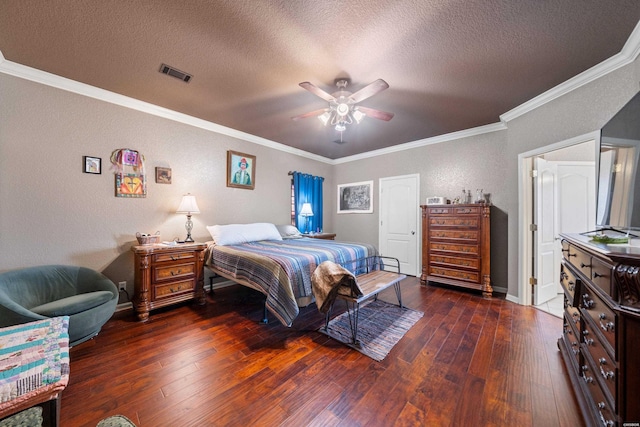 bedroom featuring crown molding, a textured ceiling, visible vents, and hardwood / wood-style floors