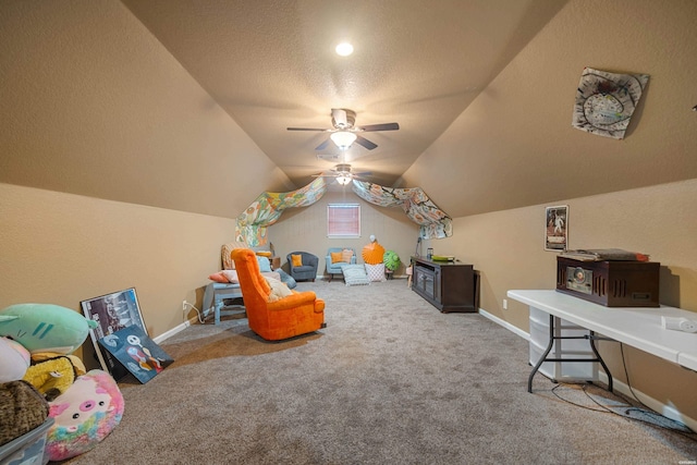 playroom with carpet floors, vaulted ceiling, a textured ceiling, and baseboards