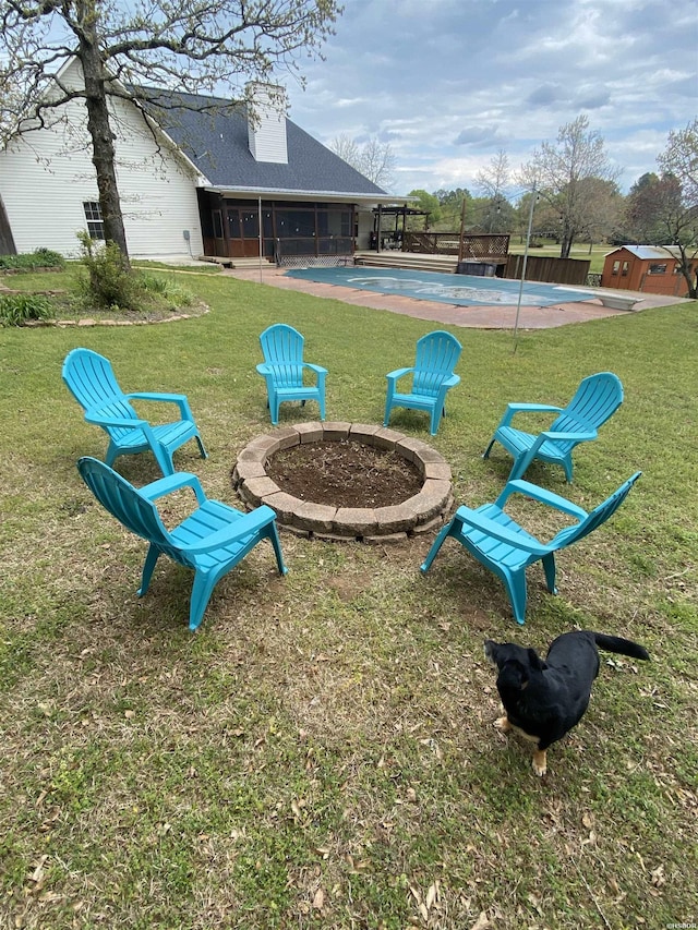 view of yard with a fire pit