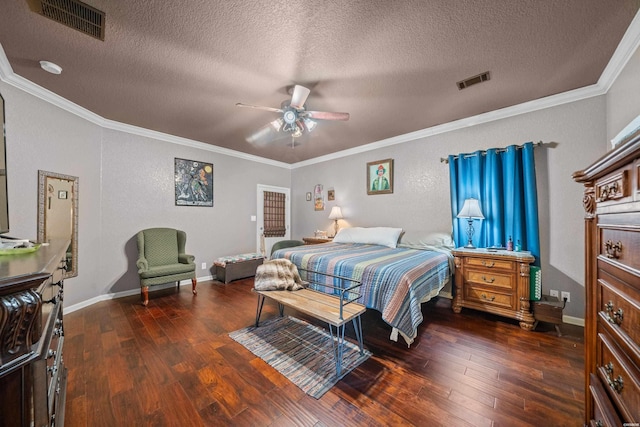 bedroom with visible vents, ornamental molding, and hardwood / wood-style flooring