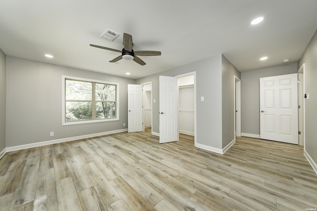 unfurnished bedroom featuring baseboards, recessed lighting, and visible vents