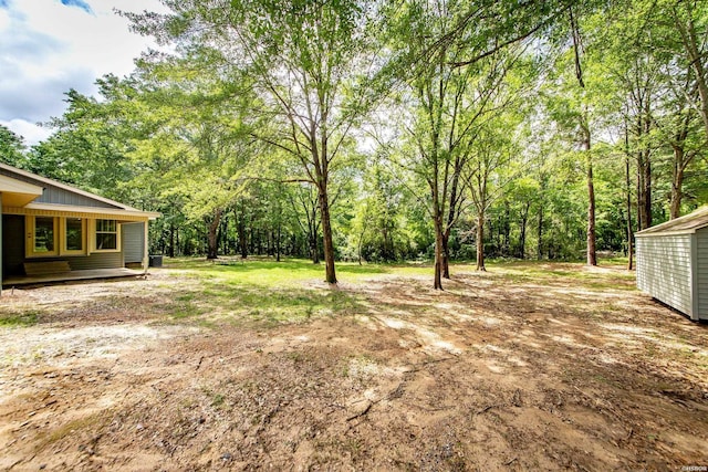 view of yard featuring a view of trees