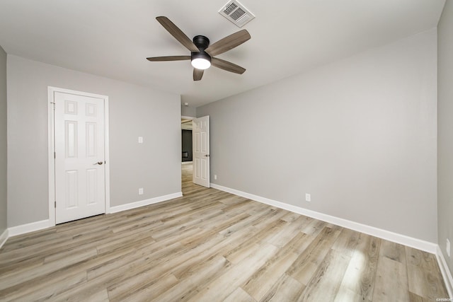 unfurnished bedroom with a ceiling fan, baseboards, visible vents, and light wood-type flooring
