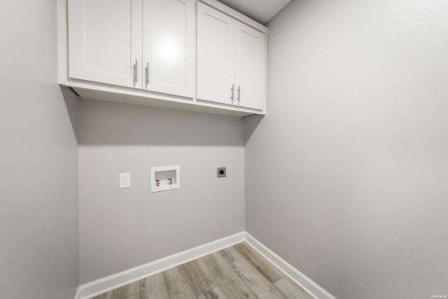 laundry area with electric dryer hookup, light wood-type flooring, cabinet space, baseboards, and hookup for a washing machine