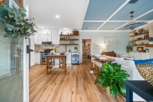 126 Chambers Pt Unit E, Hot Springs, AR 71913 - interior space with open shelves, appliances with stainless steel finishes, white cabinets, backsplash, and light wood-type flooring