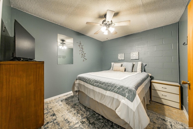 358 Buccaneer St, Hot Springs, AR 71913 - bedroom with concrete block wall, a textured ceiling, and a ceiling fan