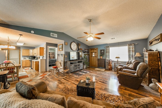 358 Buccaneer St, Hot Springs, AR 71913 - living area with light wood-style floors, a textured ceiling, lofted ceiling, and a ceiling fan